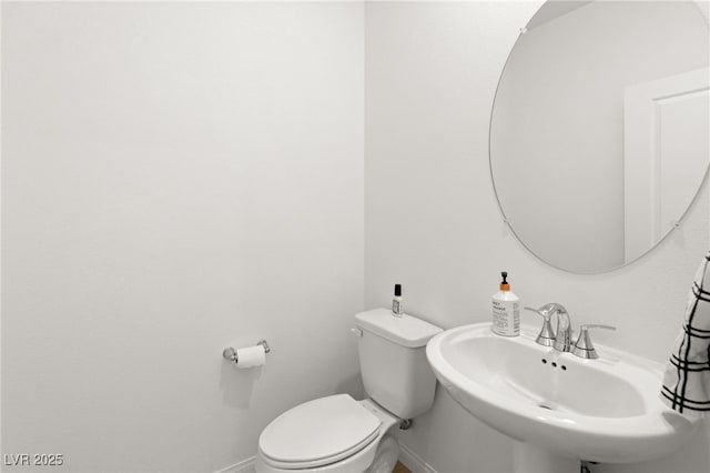 bathroom with sink and toilet