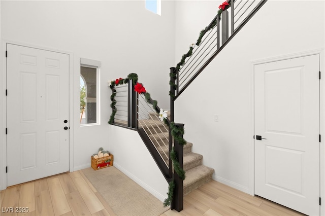 foyer entrance with light hardwood / wood-style flooring