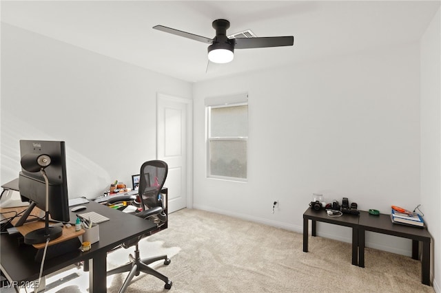 carpeted office with ceiling fan