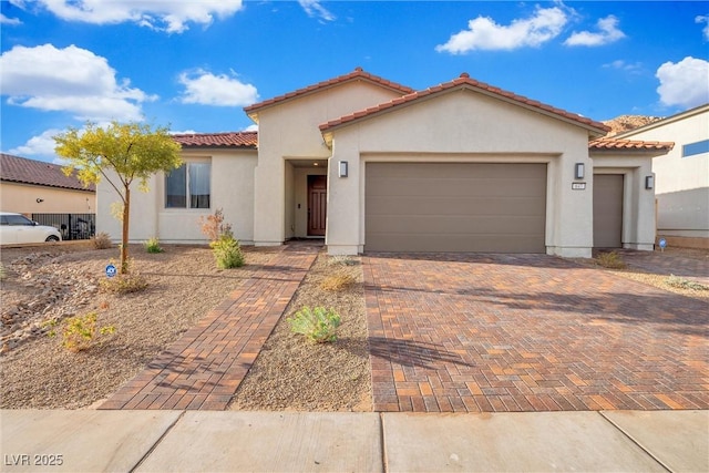 mediterranean / spanish-style house featuring a garage