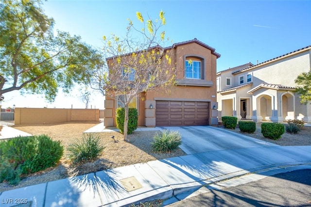 mediterranean / spanish-style home with a garage