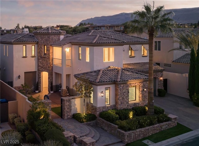 mediterranean / spanish home with a mountain view