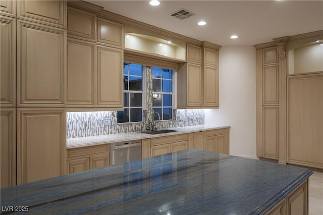 kitchen featuring dishwasher, light brown cabinets, backsplash, and sink