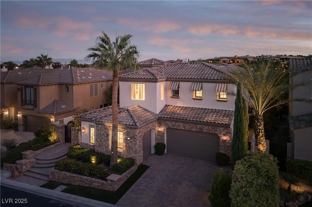 mediterranean / spanish house featuring a garage