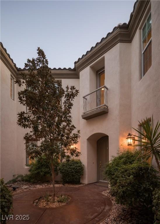 view of outdoor building at dusk