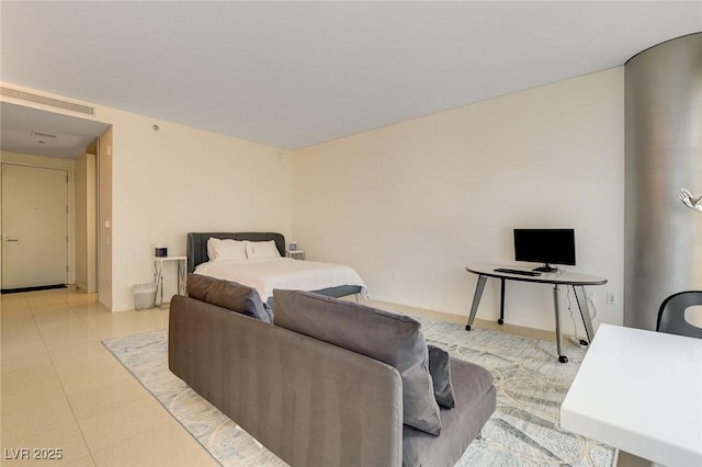 bedroom with light tile patterned floors