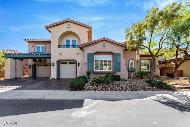 mediterranean / spanish house with a garage