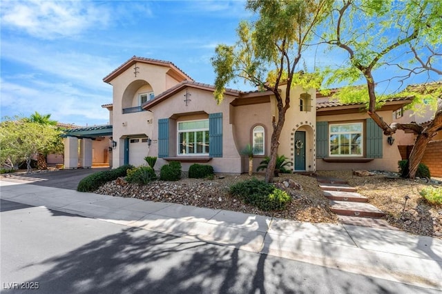 mediterranean / spanish-style home featuring a garage