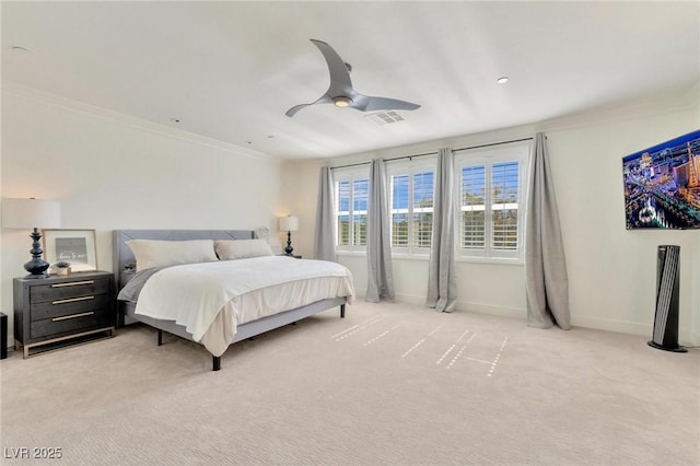 bedroom featuring ceiling fan, crown molding, and light carpet