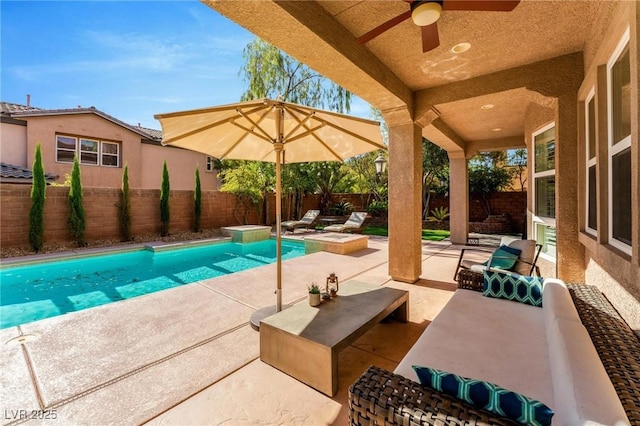 view of swimming pool with a patio area and ceiling fan