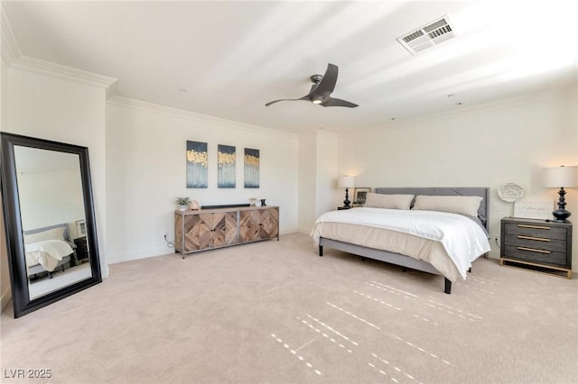 carpeted bedroom featuring ceiling fan and crown molding