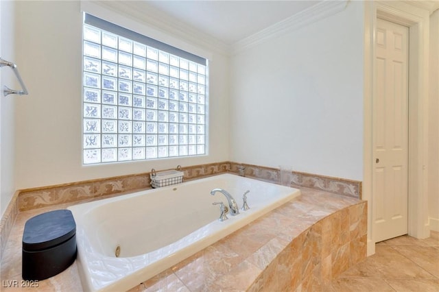 bathroom with tile patterned floors, crown molding, and tiled tub