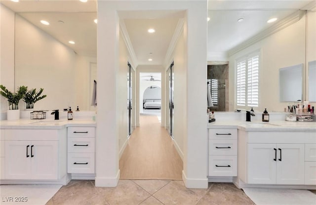 bathroom with vanity, tile patterned floors, and crown molding