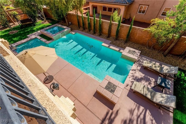 view of pool with an in ground hot tub