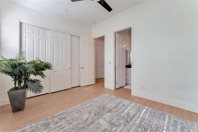 bedroom featuring ensuite bathroom, ceiling fan, ornamental molding, and light hardwood / wood-style floors