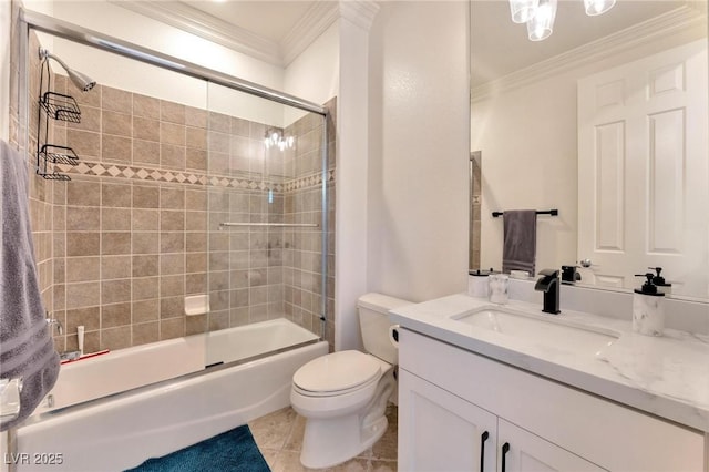 full bathroom featuring tile patterned floors, vanity, crown molding, shower / bath combination with glass door, and toilet