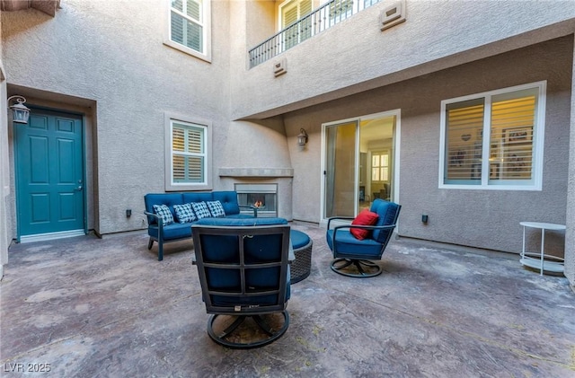 view of patio / terrace featuring outdoor lounge area and a balcony