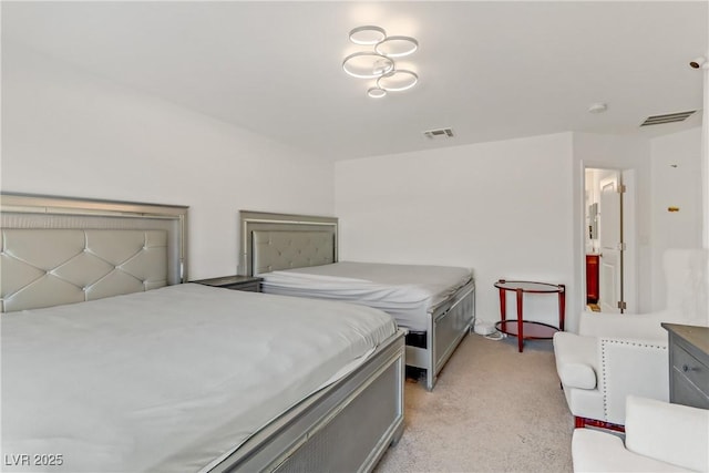 bedroom with light colored carpet