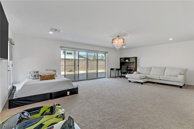 carpeted bedroom featuring access to outside and a notable chandelier