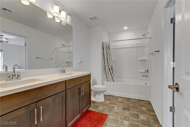 full bathroom featuring shower / bath combination with curtain, vanity, and toilet