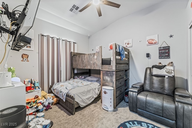 bedroom with ceiling fan, light colored carpet, and lofted ceiling