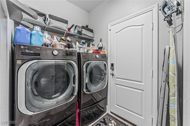 washroom with washing machine and dryer