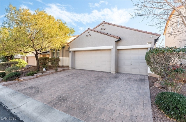 mediterranean / spanish-style home featuring a garage