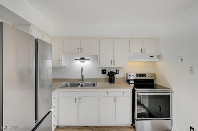 kitchen with white cabinetry, sink, wood-type flooring, and appliances with stainless steel finishes