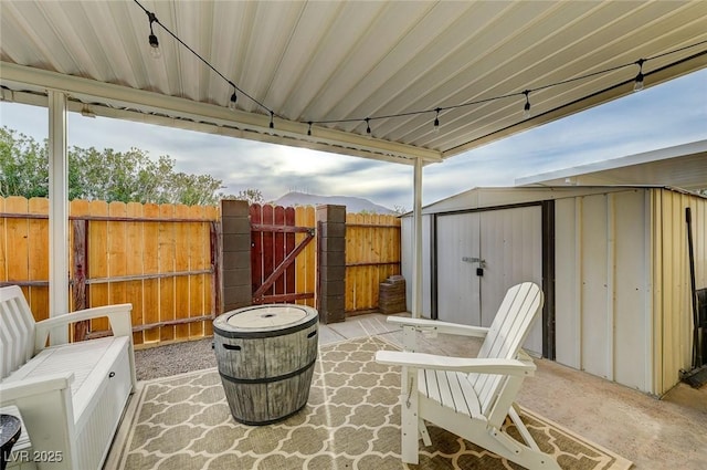 view of patio featuring a storage shed