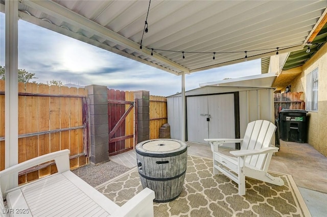 view of patio with a shed