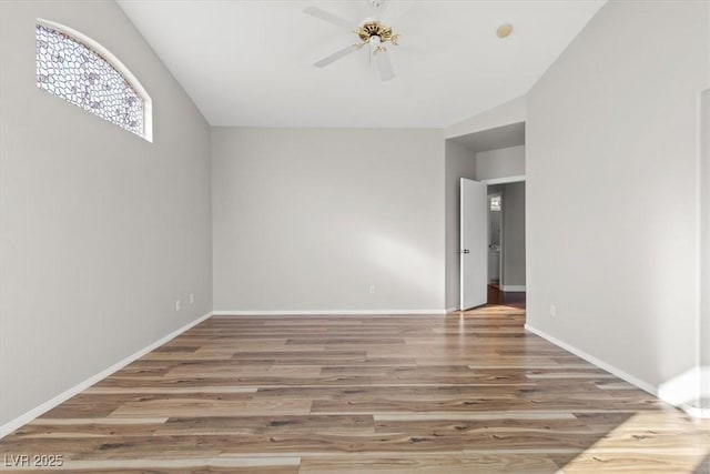 spare room with ceiling fan and wood-type flooring