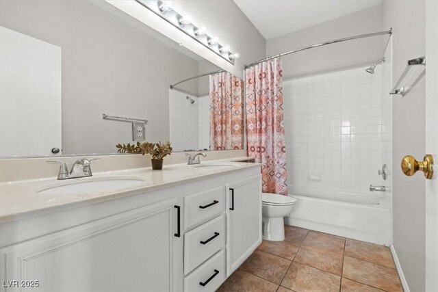 full bathroom with tile patterned flooring, vanity, toilet, and shower / tub combo