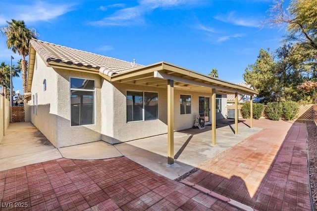 rear view of house with a patio