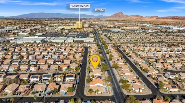 birds eye view of property with a mountain view