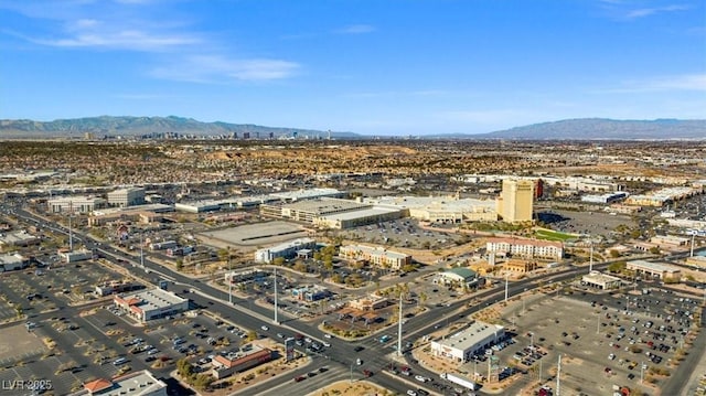 birds eye view of property featuring a mountain view