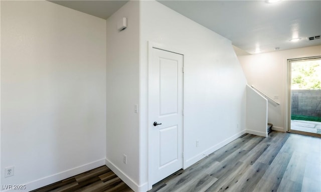 spare room with wood-type flooring