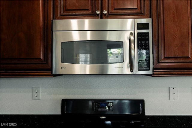 kitchen with dark brown cabinetry and range