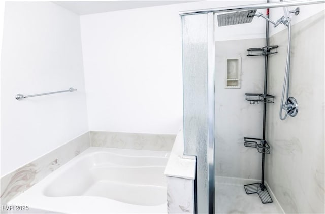 bathroom featuring shower with separate bathtub