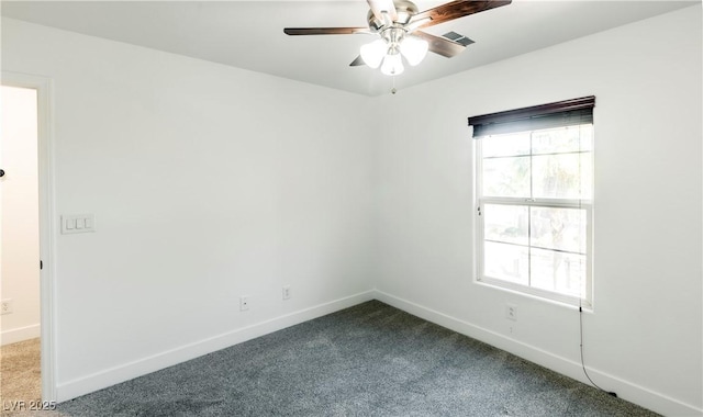 carpeted empty room featuring ceiling fan