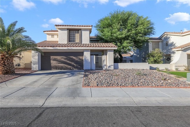 mediterranean / spanish-style home with a garage