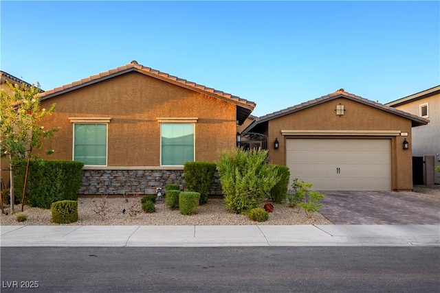 ranch-style home featuring a garage