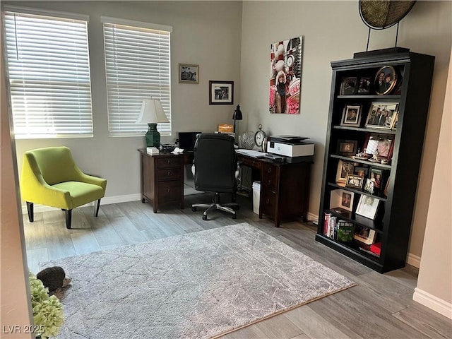 office space with light hardwood / wood-style flooring and a wealth of natural light