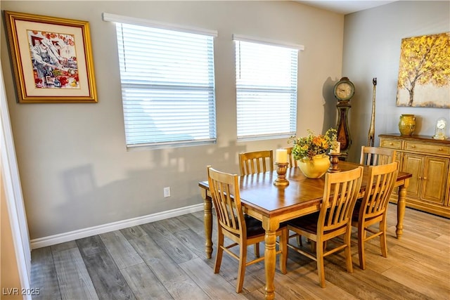 dining space featuring light wood-type flooring