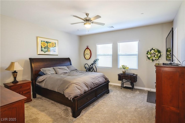 bedroom featuring light carpet and ceiling fan