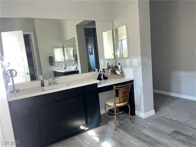 bathroom featuring wood-type flooring and vanity