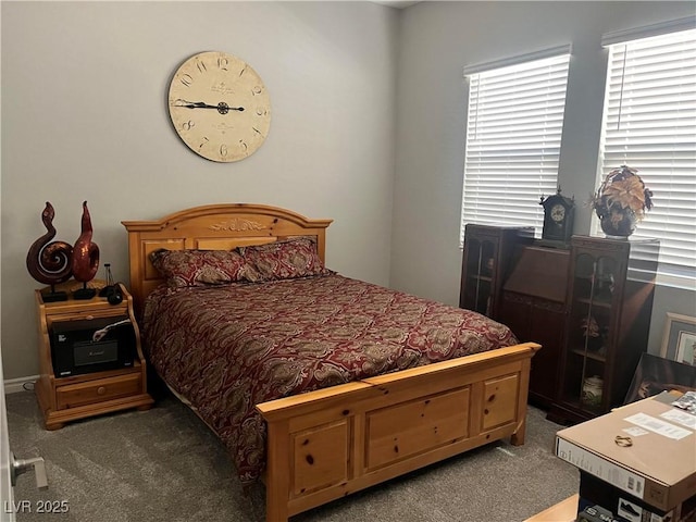 bedroom with dark carpet