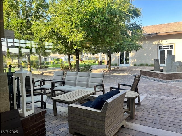 view of patio with outdoor lounge area and french doors