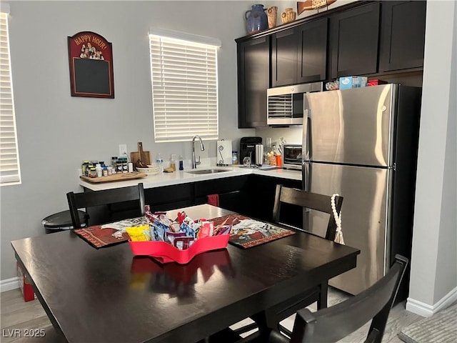 kitchen with sink and appliances with stainless steel finishes