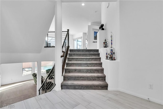 stairs featuring plenty of natural light