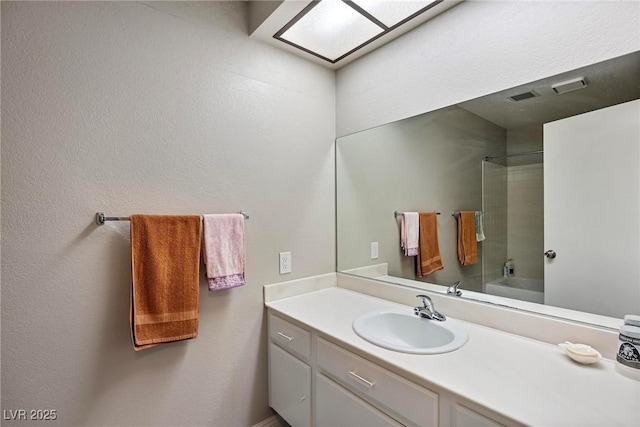 bathroom with vanity and shower / tub combination